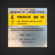 Bass Tracker Corp. Pro-17  Boat Capacity decal U.S. COASTGUARD MAXIMUM CAPACITIES  4 PERSONS OR 600 LBS 1000 LBS. PERSONS, MOTOR, GEAR 60 H.P.  MOTOR THIS BOAT COMPLIES WITH U.S. COAST GUARD STANDARDS IN EFFECT ON THE DATE OF CERTIFICATION  MANUFACTURER: 
